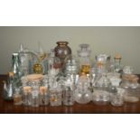 A large collection of glassware to include a set of six cocktail glasses, various storage jars,