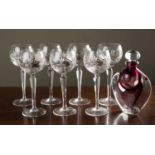 A set of seven Hock glasses with cut glass bowls on facetted stems 18.5cm high, together with an art