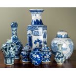 A group of eight modern Asian blue and white decorated vases to include a pair of Japanese lidded