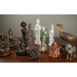 A collection of Asian deities and figurines to include bronze, terracotta and porcelain examples,