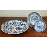 A group of three Chinese blue and white chargers, including one plate from 'The Diana Cargo' sold at