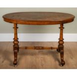 A Victorian burr walnut oval table with satinwood inlayed decoration, 118cm wide x 59cm deep x