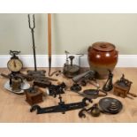 A group of antique cooking utensils to include hand mills, a set of Salter household scales number