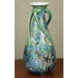 A Brannam ware vase, the blue and green ground decorated with a bird amongst foliage, three twisting