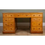 A Victorian satinwood pedestal partners desk with brown leather inset top, drawers and cupboards