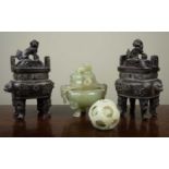 A pair of Chinese cast iron incense burners with dog of pho finials, 27cm high, together with; a