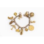 A charm bracelet, the curb-link bracelet stamped '9 .375', suspending a collection of gold and