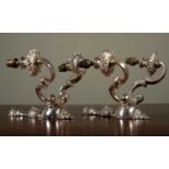 A pair of silvered two-branch metal wall lights, 30cm high (2)Scratches to the silver finish, in