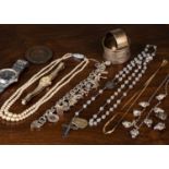 A 9 carat gold chain necklace 41cm long; a silver charm bracelet with charms including palm tree,