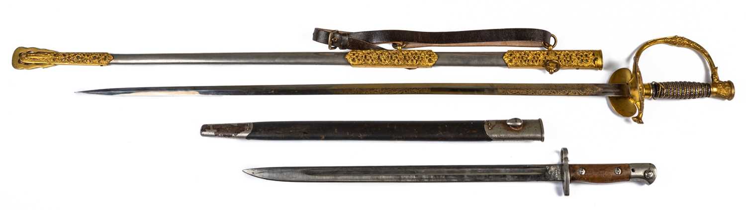 A gilt metal dress sword, with engraved scrolling decoration on the blade and scabbard, 97cm long, - Image 2 of 3