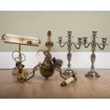 A pair of white metal three-branch candelabra on turned bases, 39cm high, together with; a brass