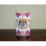 A large 19th century Samson porcelain armorial tankard with floral decoration and a coat of arms