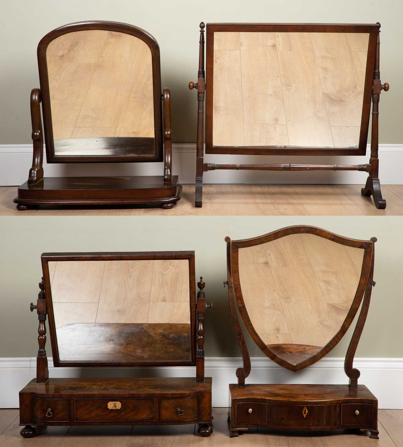 A group of four dressing table mirrors; including a Georgian mahogany serpentine fronted example