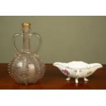 A Meissen sauce boat, 23cm long, and a Venetian glass decanter or flask with gilding and twin