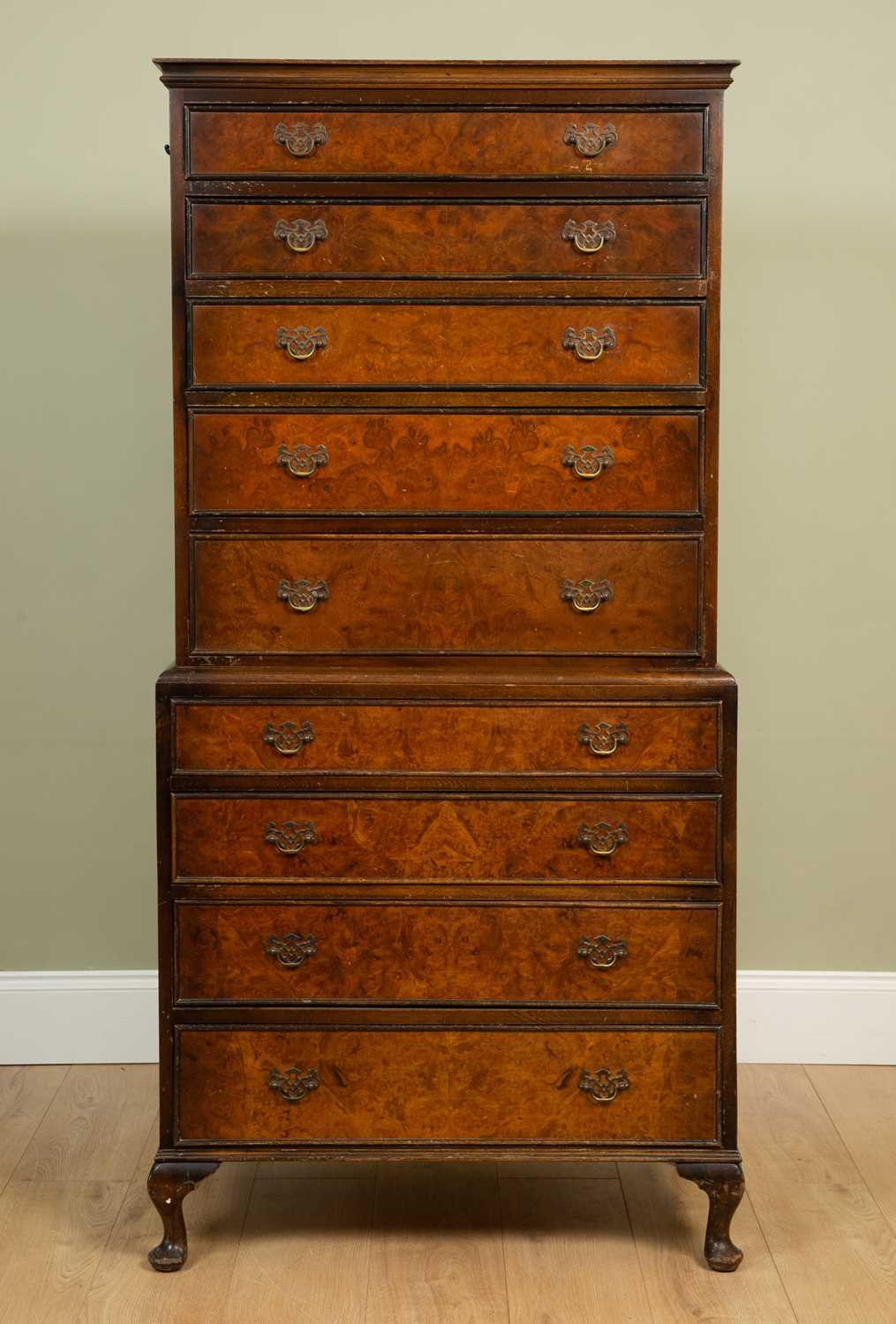 A group of walnut bedroom furniture consisting of a chest on chest in the Georgian style on short