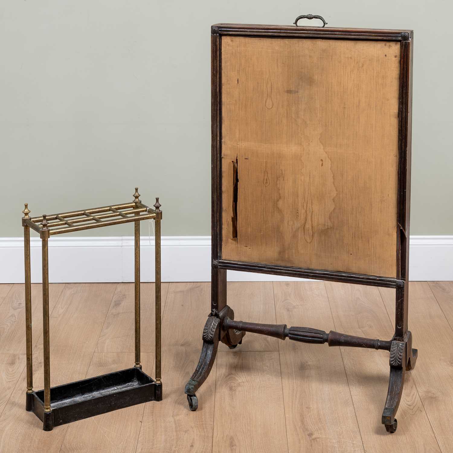 A 19th century brass and cast iron stick stand, 35cm wide x 58cm high; together with a 19th