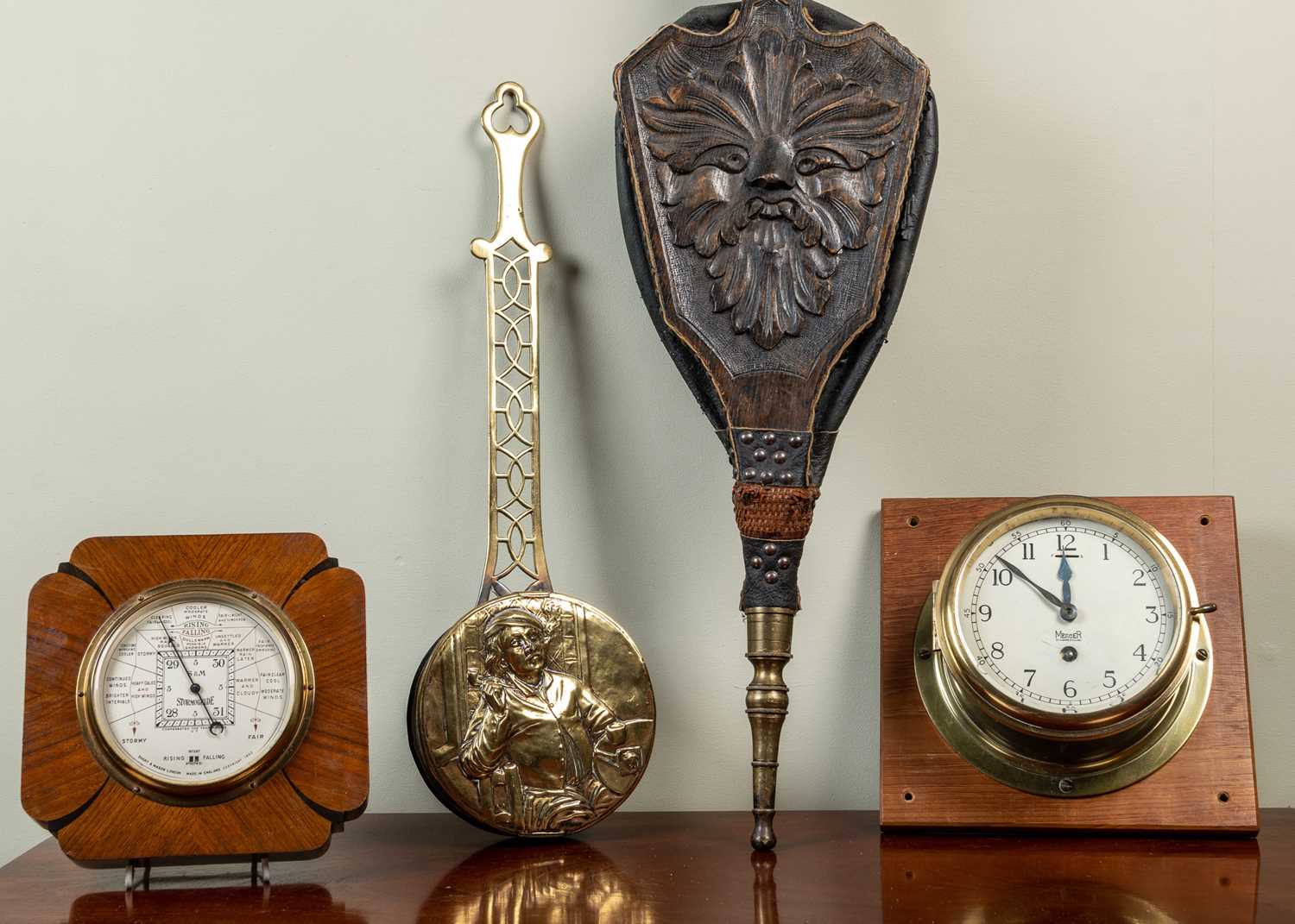 A brass ship's clock by Mercer, 20cm diameter mounted on a hardwood stand; together with a Short &