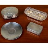 A silver pin dish set with a 1965 crown, a silver ring box, a Victorian silver snuff box, and a