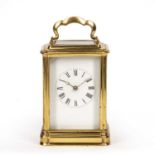 A 19th century French gilt brass carriage clock with white enamel Roman dial and Breguet hands,