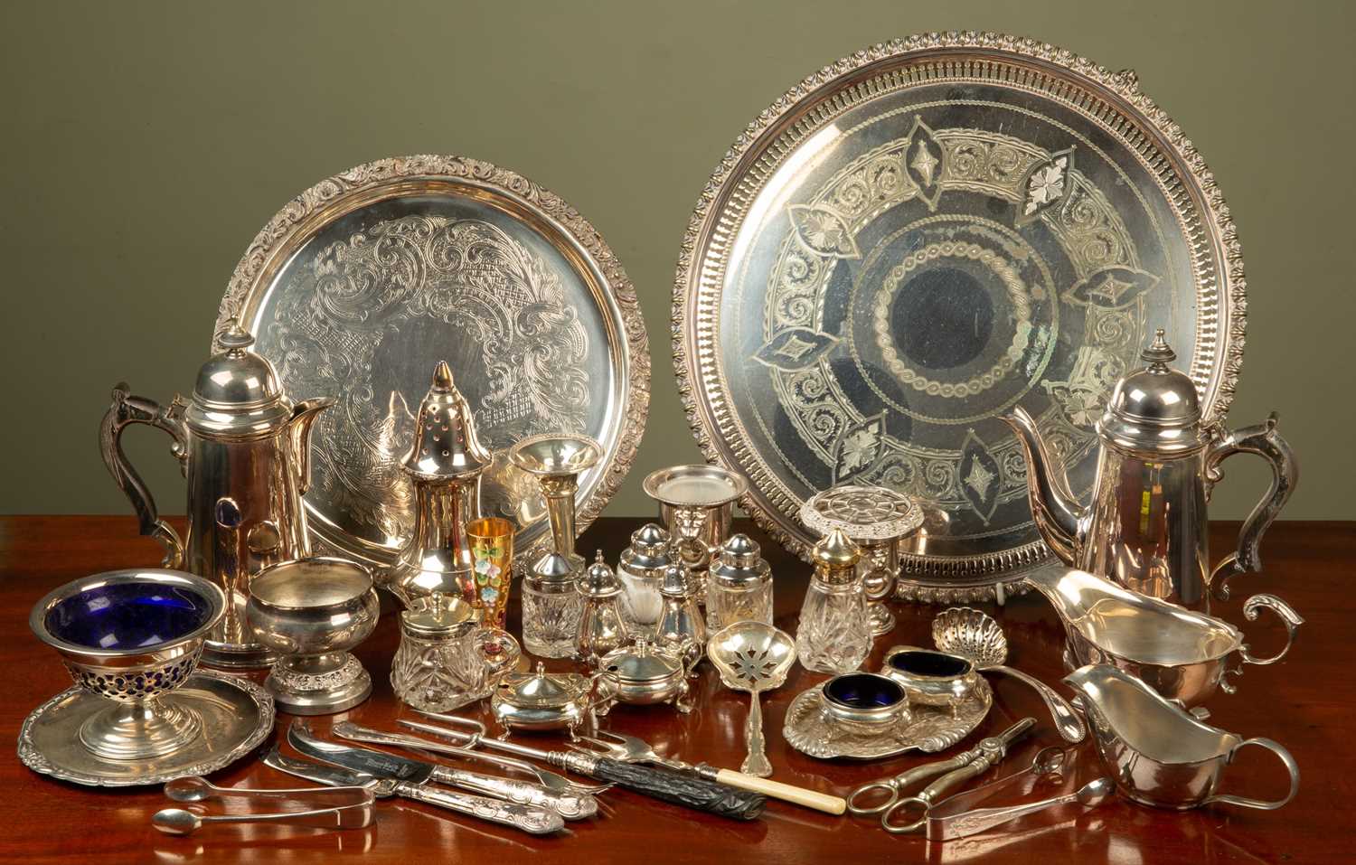 A small group of silver and silver plate: the silver items to include condiments; two butter knives;