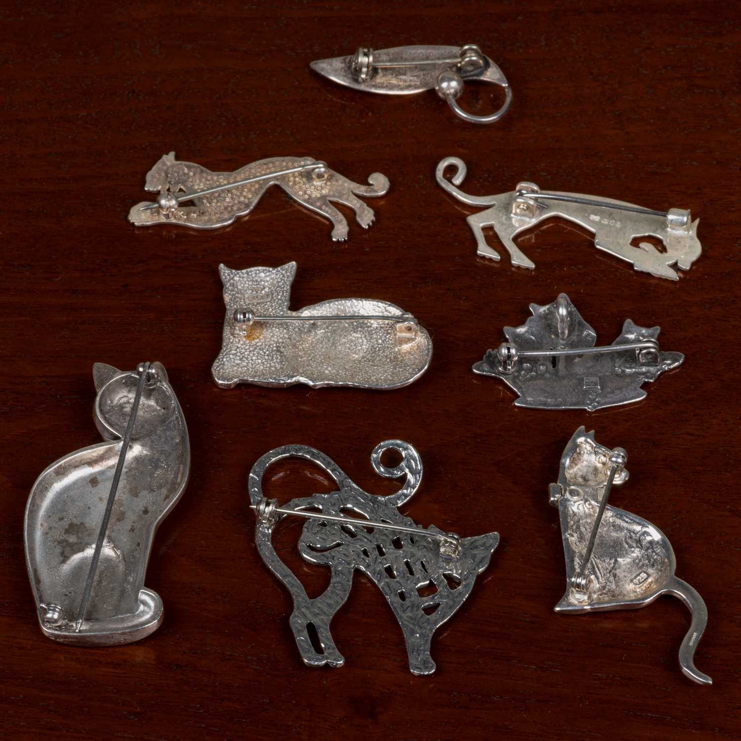 Two silver cat brooches, five further cat brooches, and a Mexican leaf brooch stamped sterling (7). - Image 2 of 2