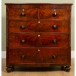 A 19th century mahogany bow front chest of two short and three long drawers with turned knob handles