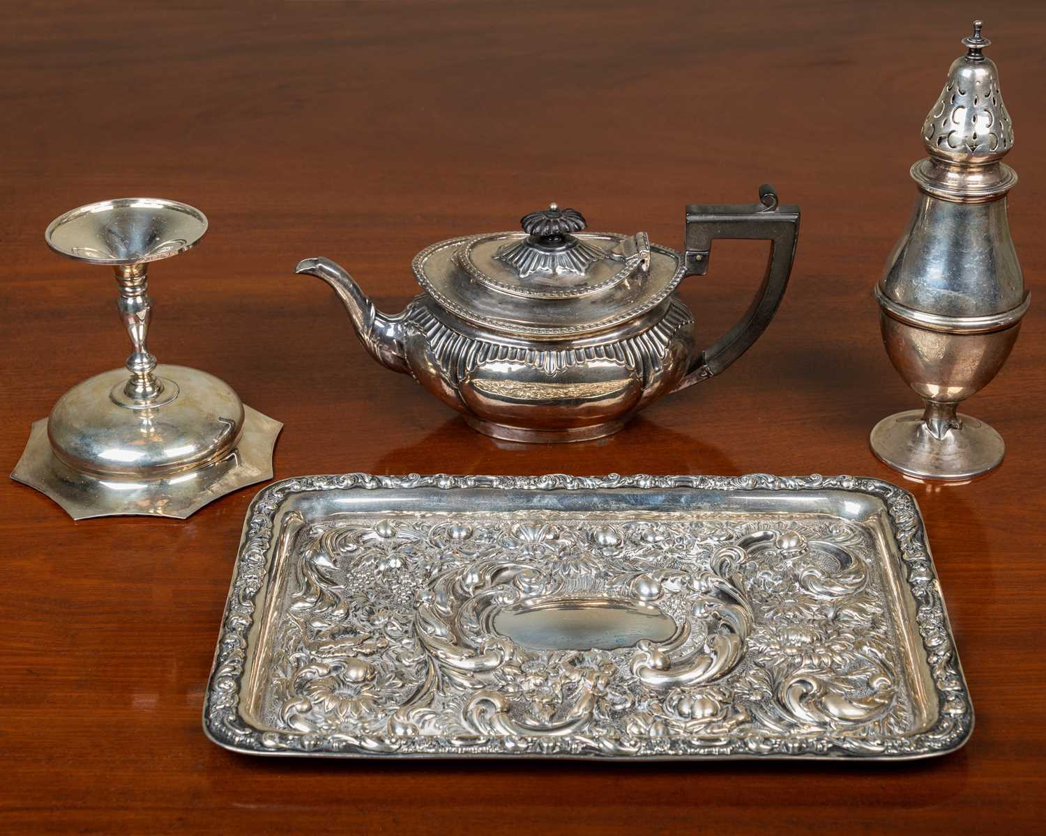 A silver dressing table tray, 29.2cm wide, a castor, a sweet meat dish on stand, and a silver