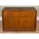 A late 20th Century oak veneered side cabinet, with four drawers over two cupboards, 110cm wide x