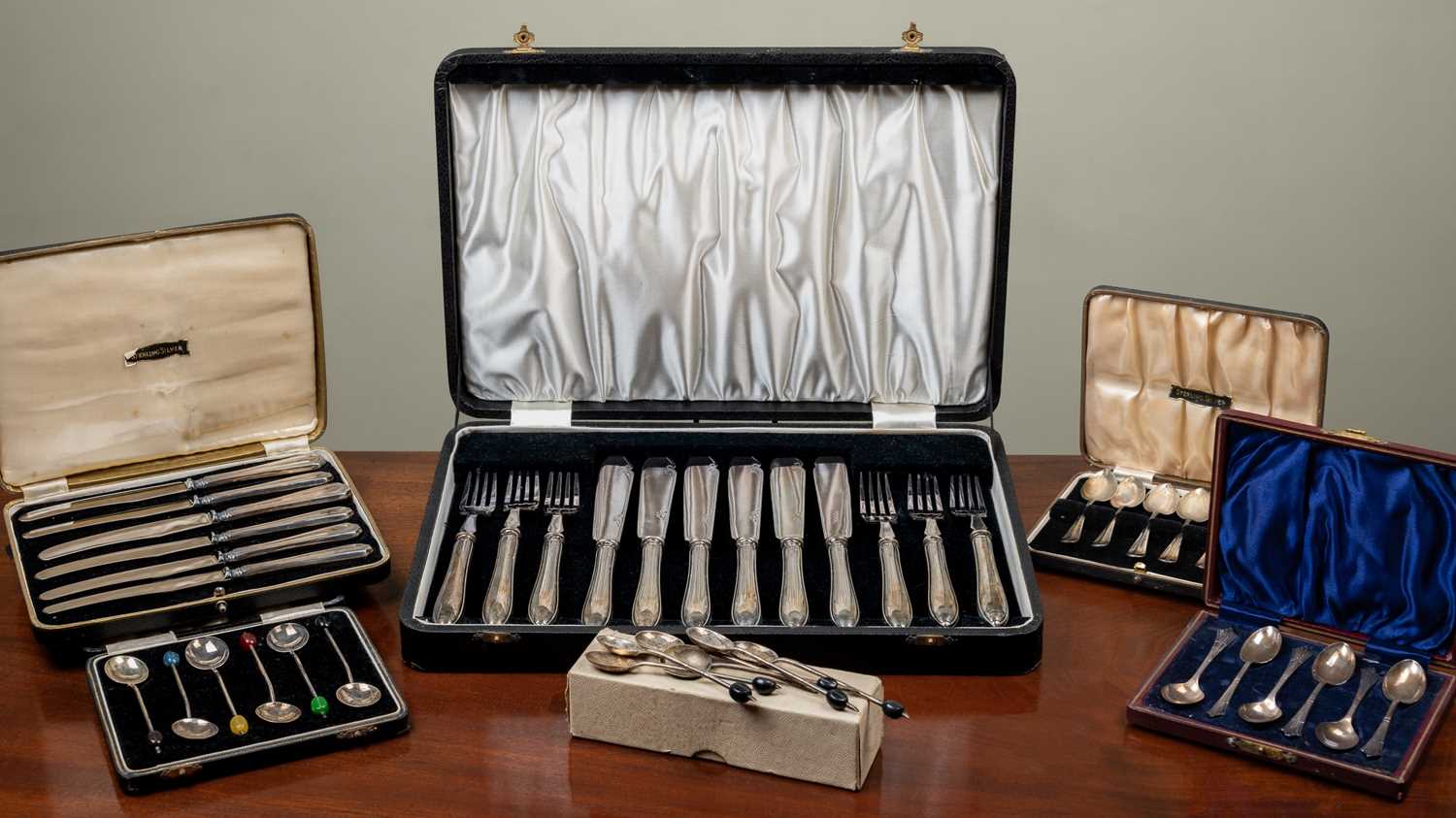 Four sets of silver coffee spoons and items of plate, six silver-handled fish knives and forks,