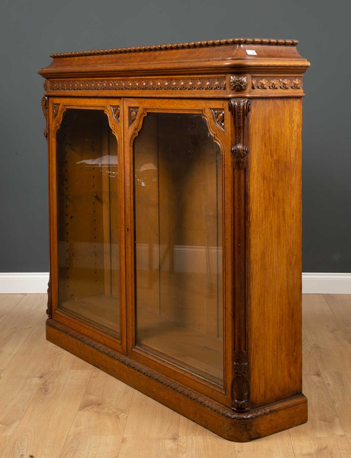 A Victorian oak bookcase with twin glazed doors, two adjustable shelves and a plinth base, 152cm - Image 3 of 5