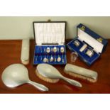 A four piece silver backed dressing table set together with a set of six silver apostle teaspoons