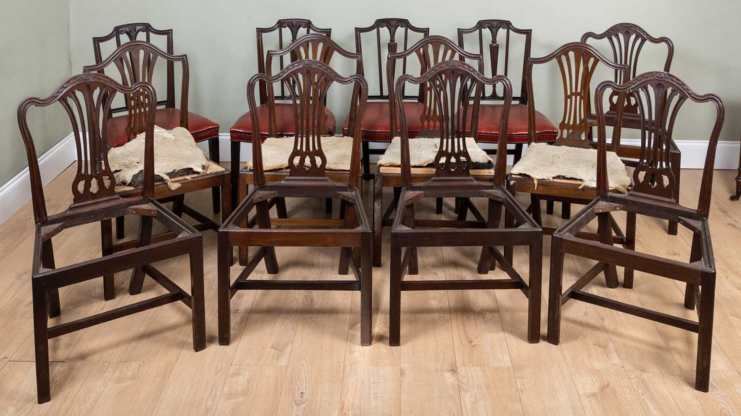 A set of five George III mahogany side chairs together with two further sets of four dining