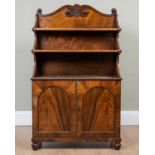 A William V rosewood waterfall bookcase with arching panelled doors beneath the shelves and on