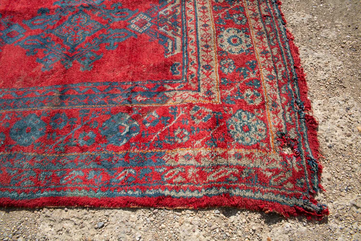 A large red ground Turkey carpet with geometric decoration, 430cm x 407cmStains, marks and minor - Image 3 of 7