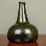 An early 18th Century 'onion' wine bottle, possibly Dutch, 13cm diameter and 17cm highMinor chips