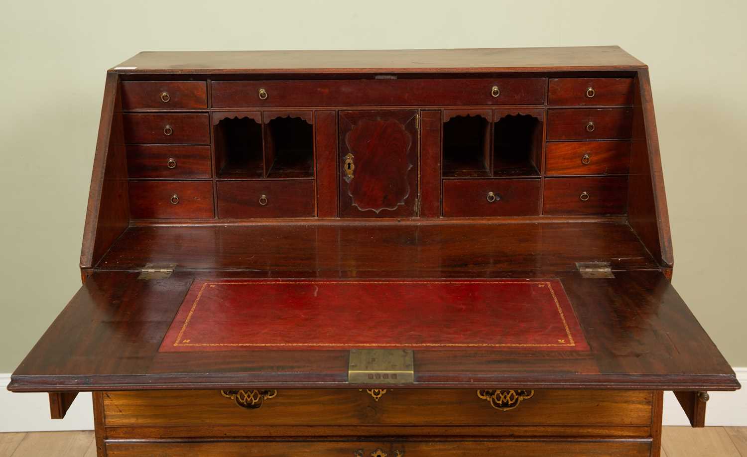 A George III mahogany bureau the fall front enclosing a fitted interior with drawers and pigeon - Image 2 of 12