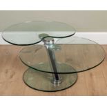 A contemporary Italian style lily pad metamorphic table with two tiered glass top on a circular