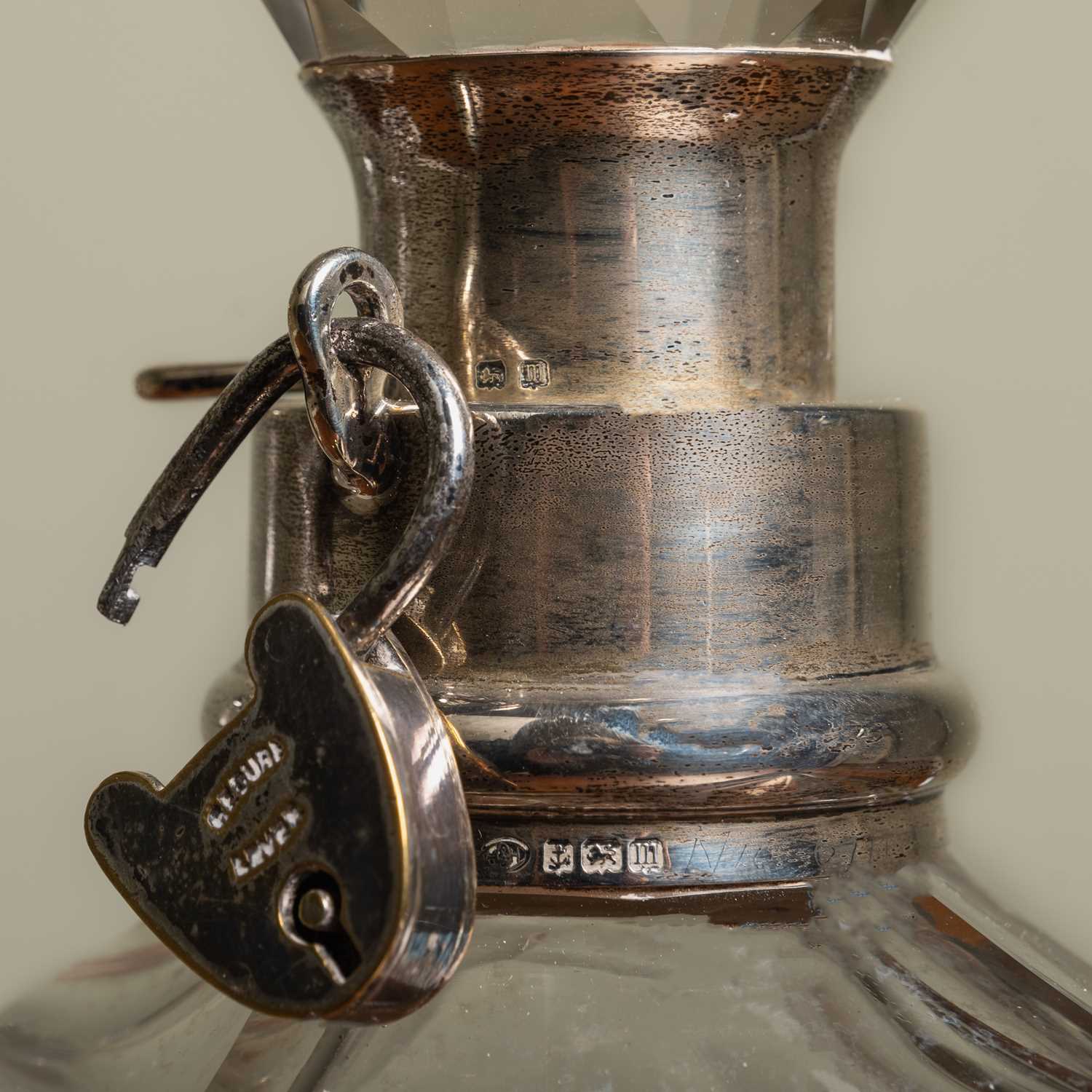 An early 20th century decanter with a silver collar and silver plated padlock, 14cm wide x 23cm high - Image 2 of 2