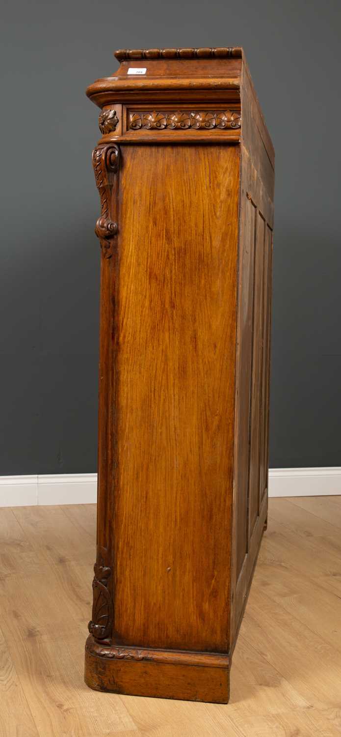 A Victorian oak bookcase with twin glazed doors, two adjustable shelves and a plinth base, 152cm - Image 4 of 5