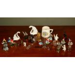 A collection of various blown glass continental novelties to include animals; a man walking a pig;
