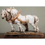 A continental porcelain model of two shire horses 37cm wide x 27cm highIn good condition with some