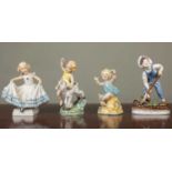 A group of four Royal Worcester figurines of children to include: 'Masquerade'; 'Saturday's