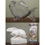 A large pottery sculpture of a rabbit, approximately 46cm long x 36cm high; together with a glass