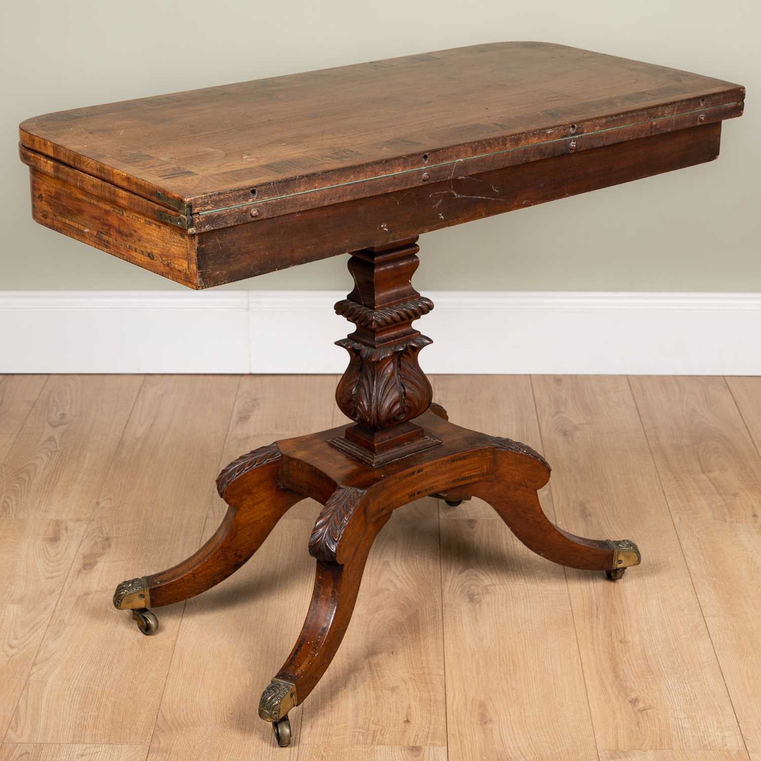 A George IV mahogany foldover card table with rosewood cross banded top, carved support and four - Image 5 of 7