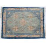 A Chinese light blue ground carpet with floral decoration and blue border, 314cm x 244cmStains,