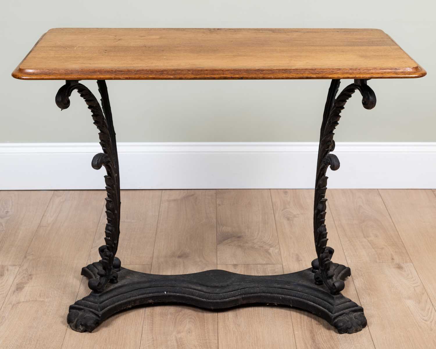 A Victorian cast iron and mahogany conservatory table, the rectangular top on acanthus leaf cast