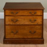 A 19th century oak three graduated drawer chest with swan neck brass handles, on a plinth base, 70cm