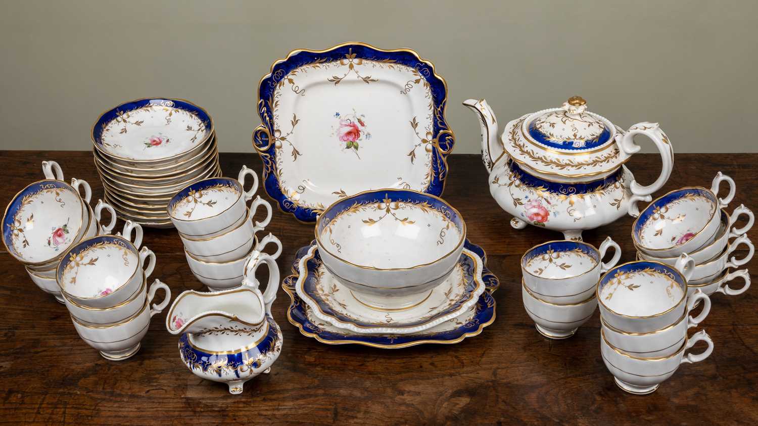 A 19th century part tea set with rose decorations, unmarked and with a teapot, teacups, coffee cups, - Image 13 of 17