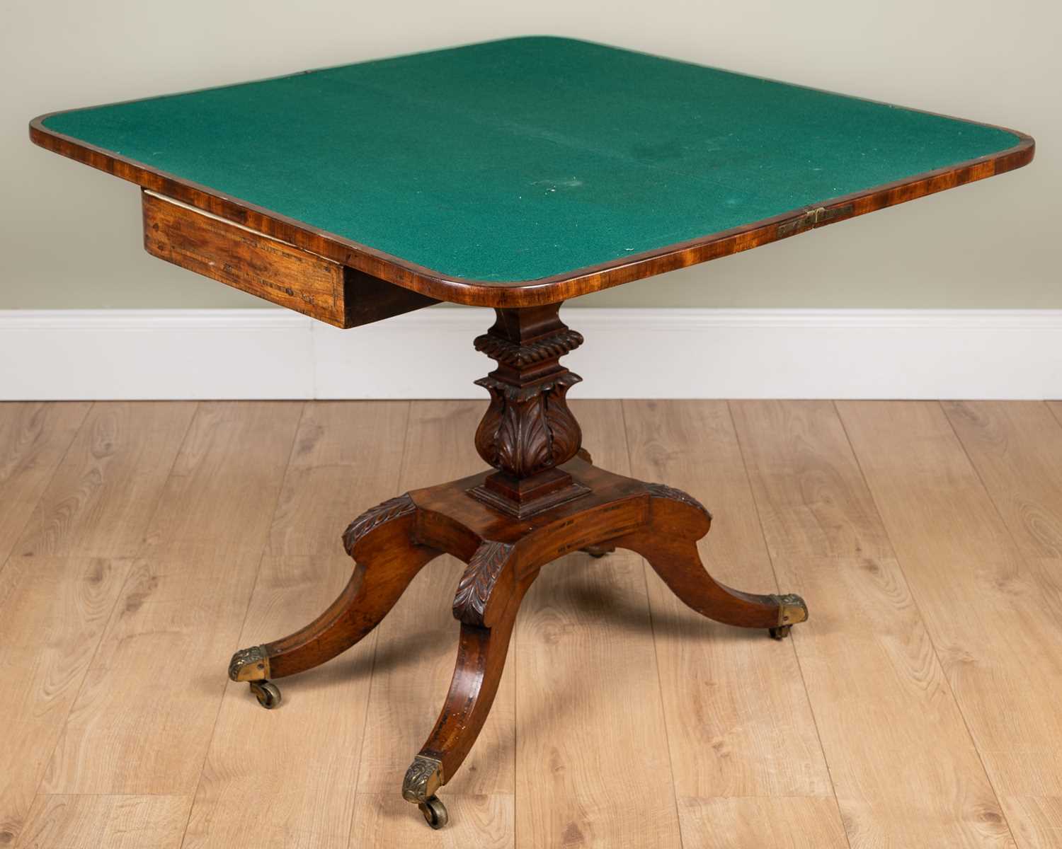 A George IV mahogany foldover card table with rosewood cross banded top, carved support and four - Image 6 of 7