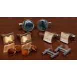 A pair of engraved baton cufflinks with blue stone set ends, stamped 9ct, 7.9 grams in weight,